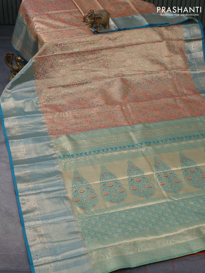 Tissue semi kanjivaram saree teal green shade red and teal blue with allover floral brocade weaves and long zari woven border