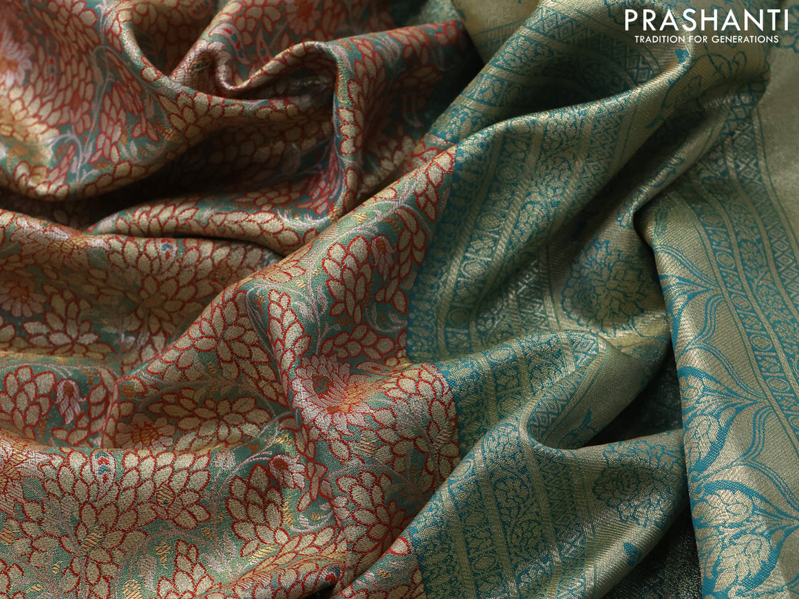 Tissue semi kanjivaram saree teal green shade red and teal blue with allover floral brocade weaves and long zari woven border