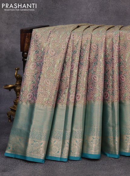 Tissue semi kanjivaram saree teal green purple and blue shade with allover floral brocade weaves and long zari woven border