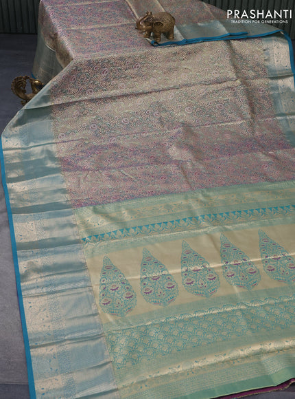 Tissue semi kanjivaram saree teal green purple and blue shade with allover floral brocade weaves and long zari woven border