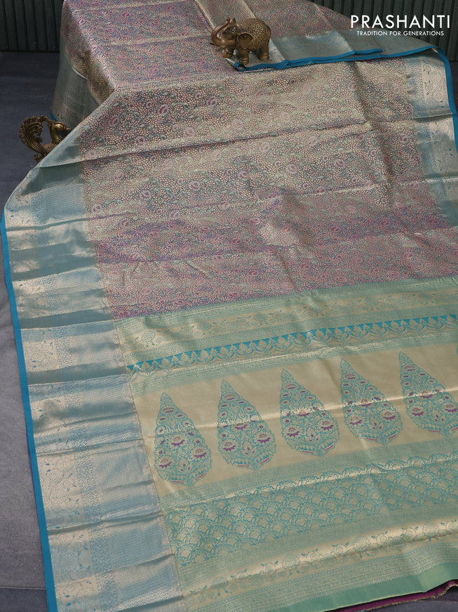 Tissue semi kanjivaram saree teal green purple and blue shade with allover floral brocade weaves and long zari woven border