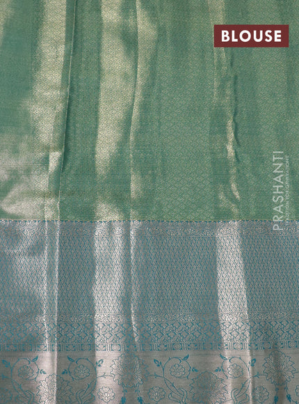 Tissue semi kanjivaram saree teal green purple and blue shade with allover floral brocade weaves and long zari woven border