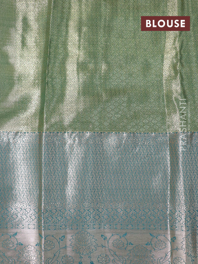 Tissue semi kanjivaram saree mustard shade and peacock green with allover floral brocade weaves and long zari woven border