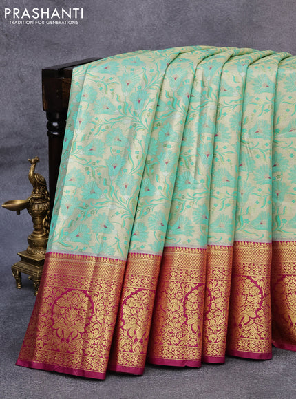 Tissue semi kanjivaram saree cream teal green shade and purple with allover floral brocade weaves and long zari woven border