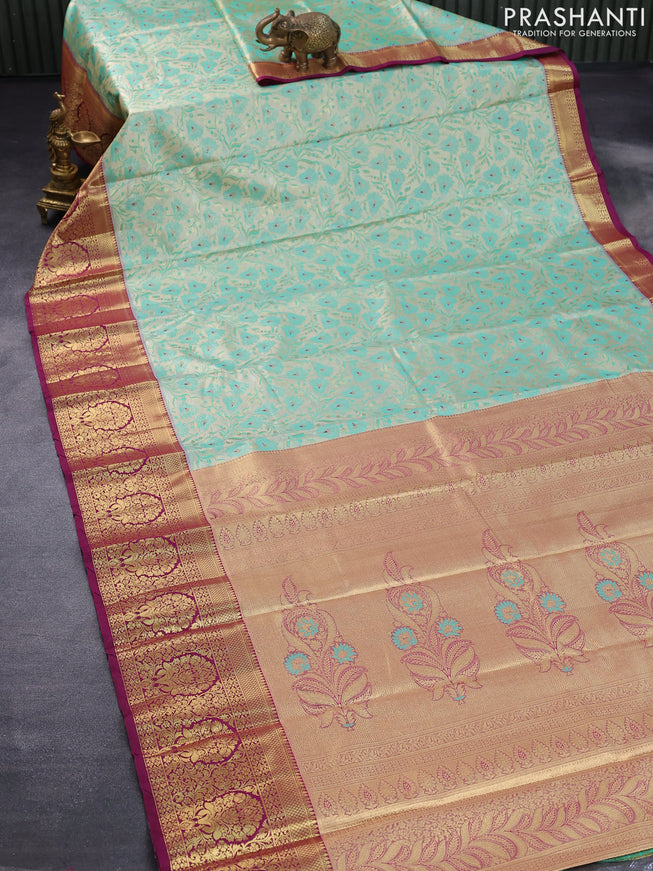 Tissue semi kanjivaram saree cream teal green shade and purple with allover floral brocade weaves and long zari woven border