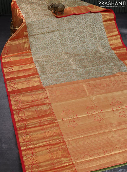 Tissue semi kanjivaram saree cream and red with allover brocade weaves and long zari woven border