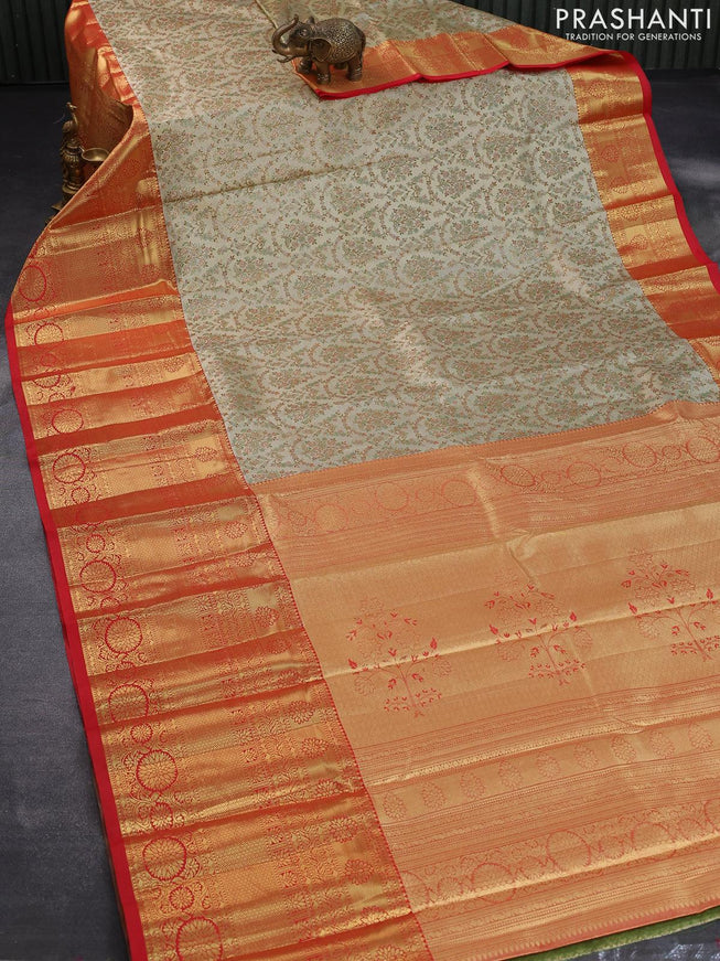 Tissue semi kanjivaram saree cream and red with allover brocade weaves and long zari woven border