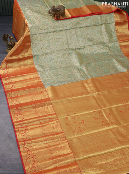 Tissue semi kanjivaram saree beige teal green and red with allover brocade weaves and long zari woven border