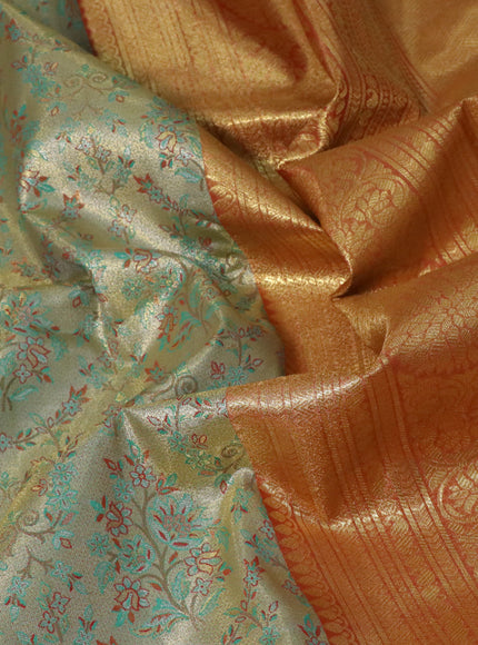 Tissue semi kanjivaram saree beige teal green and red with allover brocade weaves and long zari woven border