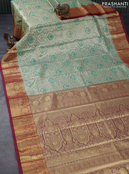 Tissue semi kanjivaram saree beige teal green and maroon with allover brocade weaves and floral zari woven border