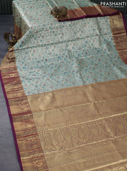 Tissue semi kanjivaram saree cream teal green and wine shade with allover floral brocade weaves and floral zari woven border