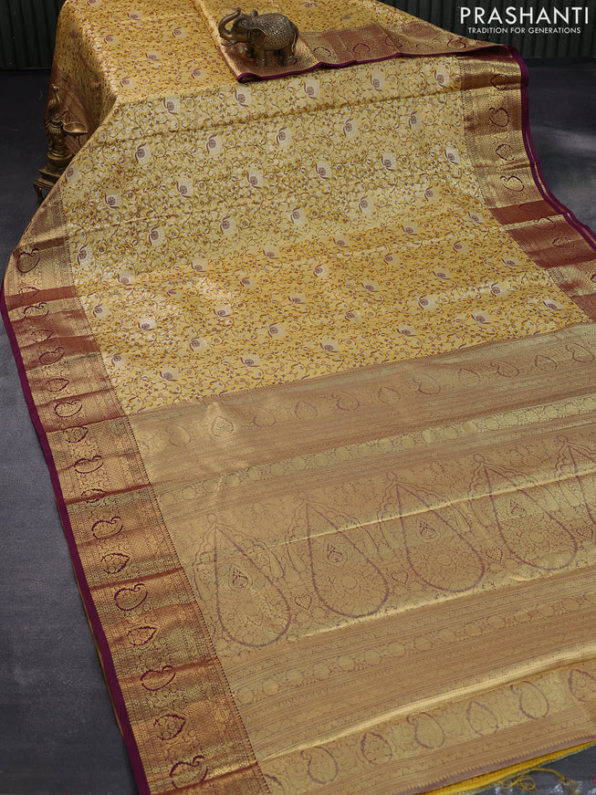 Tissue semi kanjivaram saree yellow and purple with allover brocade weaves and zari woven border