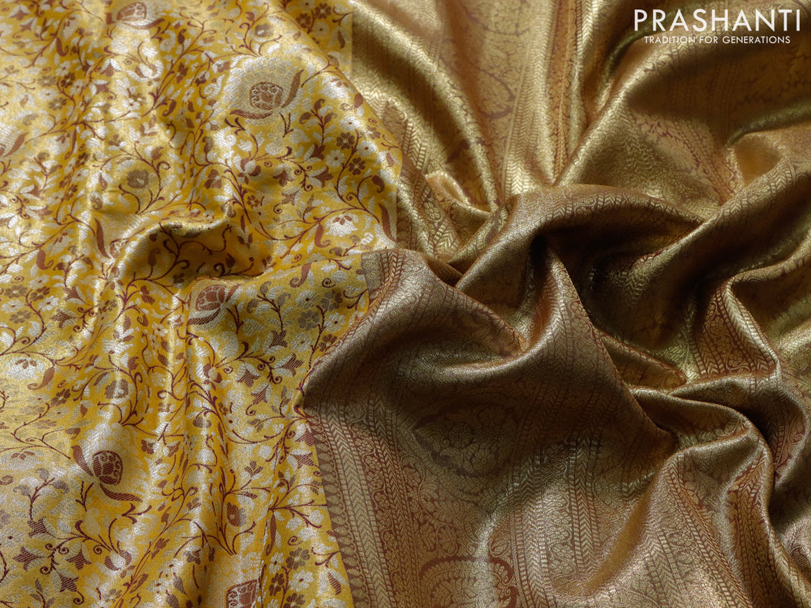 Tissue semi kanjivaram saree yellow and purple with allover brocade weaves and zari woven border