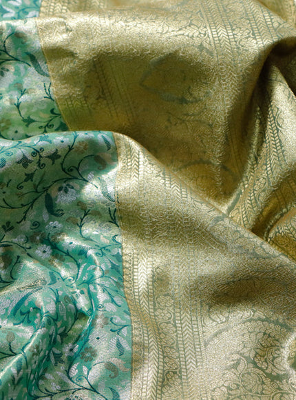 Tissue semi kanjivaram saree teal green and green with allover brocade weaves and zari woven border