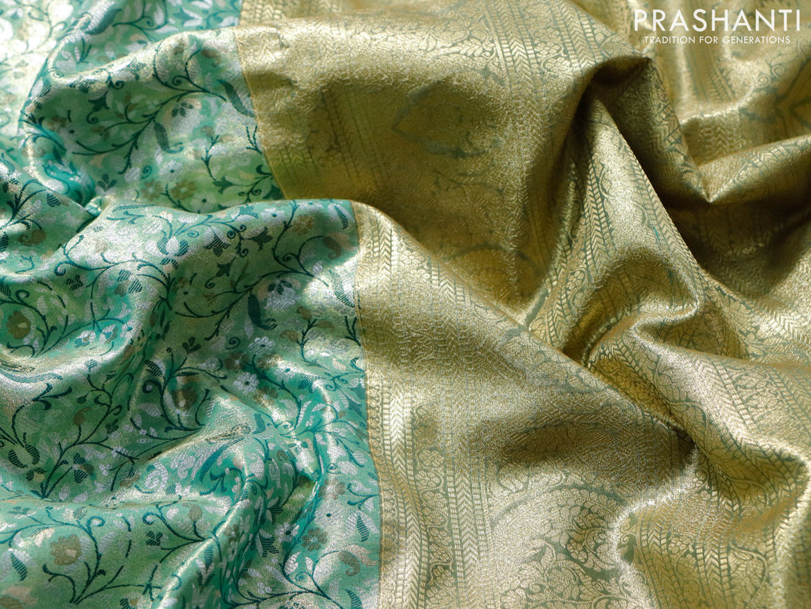 Tissue semi kanjivaram saree teal green and green with allover brocade weaves and zari woven border