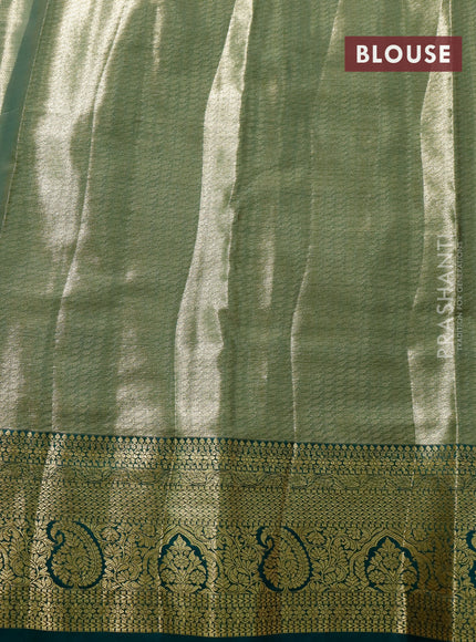 Tissue semi kanjivaram saree pink shade and green with allover brocade weaves and zari woven border