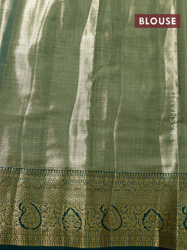 Tissue semi kanjivaram saree pink shade and green with allover brocade weaves and zari woven border