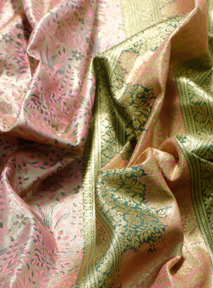 Tissue semi kanjivaram saree cream pink shade and green with allover brocade weaves and long floral zari woven border