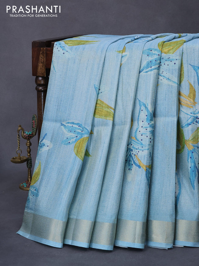 Crushed tissue saree light blue with allover floral digital prints and zari woven border
