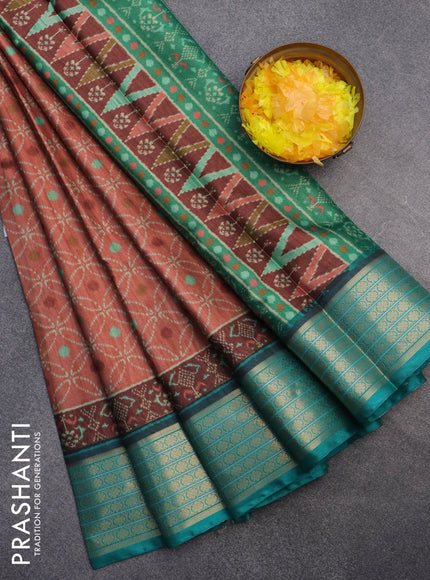 Semi kanchipuram silk saree rust shade and teal green with allover prints and zari woven border