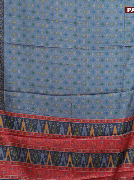 Semi kanchipuram silk saree blue shade and red with allover prints and zari woven border