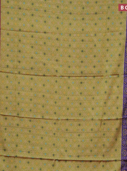 Semi kanchipuram silk saree light green and purple with allover prints and zari woven border