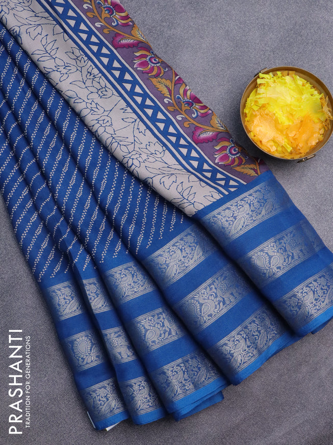 Semi georgette saree peacock blue with allover prints and long zari woven border