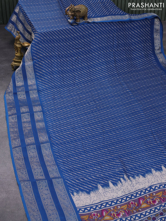 Semi georgette saree peacock blue with allover prints and long zari woven border