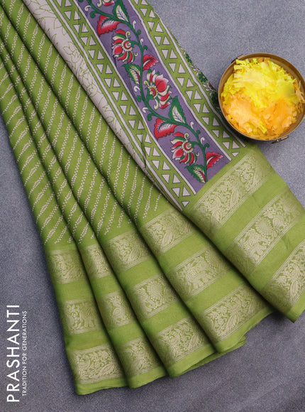 Semi georgette saree light green with allover prints and long zari woven border