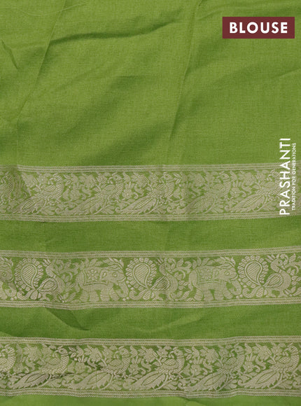 Semi georgette saree light green with allover prints and long zari woven border