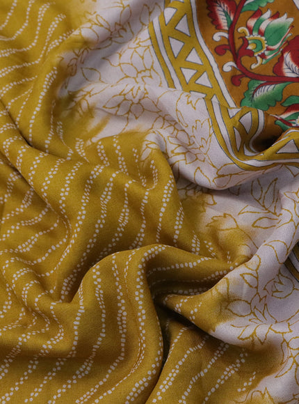 Semi georgette saree mustard yellow with allover prints and long zari woven border