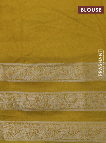 Semi georgette saree mustard yellow with allover prints and long zari woven border