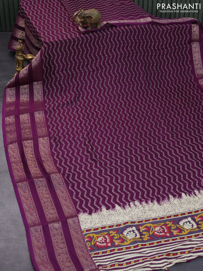 Semi georgette saree deep purple with allover zig zag prints and long zari woven border