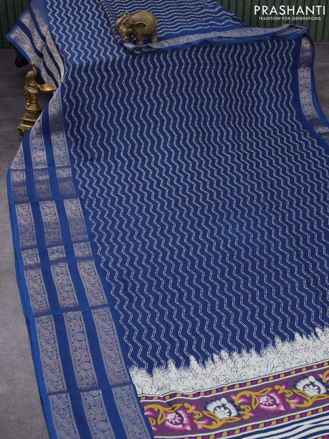 Semi georgette saree cs blue with allover zig zag prints and long zari woven border