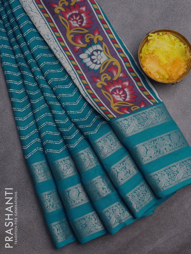 Semi georgette saree cs blue with allover zig zag prints and long zari woven border