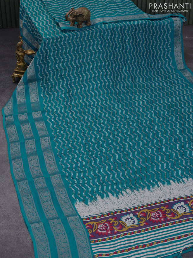 Semi georgette saree cs blue with allover zig zag prints and long zari woven border