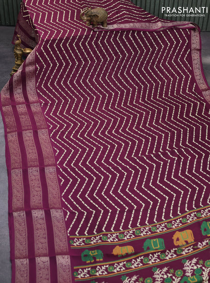 Semi georgette saree wine shade with allover zig zag prints and long zari woven border