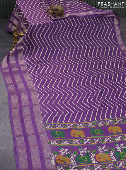 Semi georgette saree violet with allover zig zag prints and long zari woven border