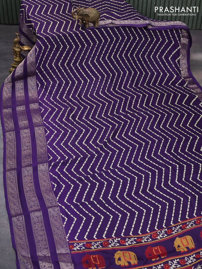 Semi georgette saree deep violet with allover zig zag prints and long zari woven border