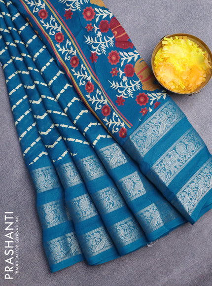 Semi georgette saree cs blue with allover zig zag prints and long zari woven border