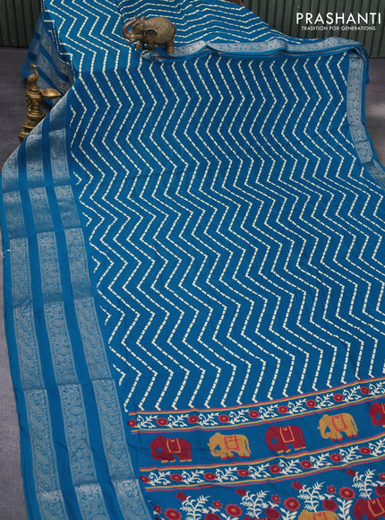 Semi georgette saree cs blue with allover zig zag prints and long zari woven border