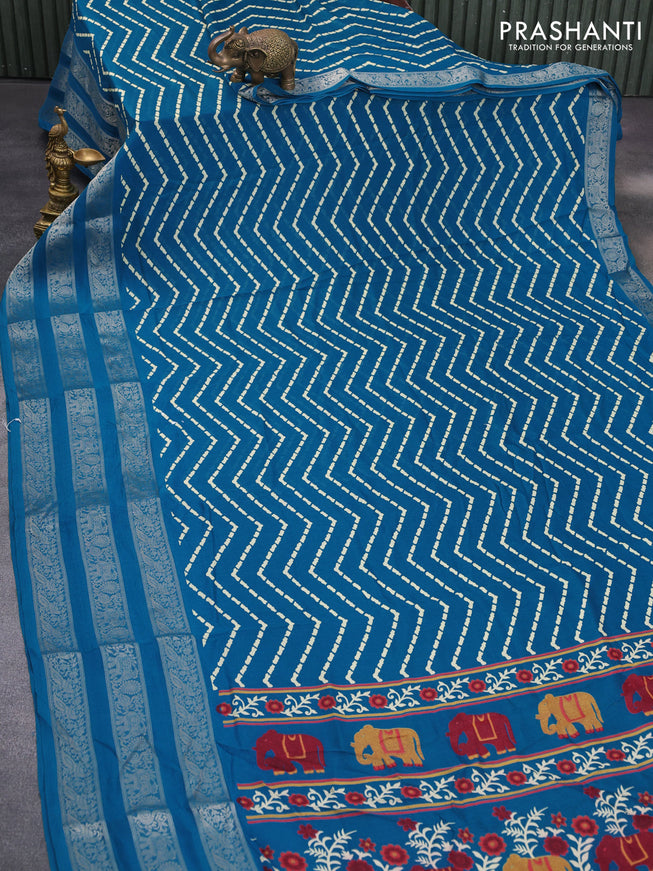 Semi georgette saree cs blue with allover zig zag prints and long zari woven border