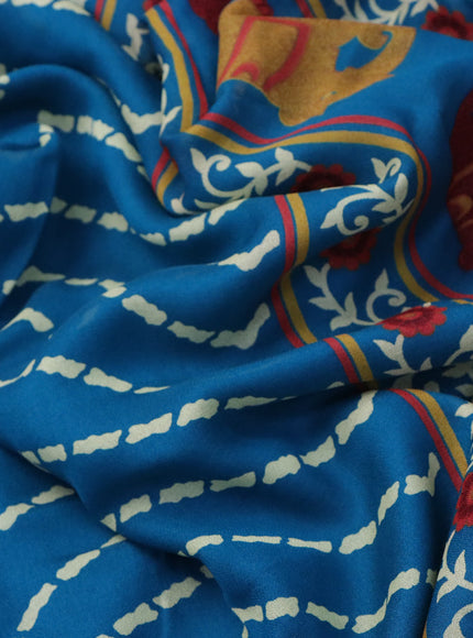 Semi georgette saree cs blue with allover zig zag prints and long zari woven border