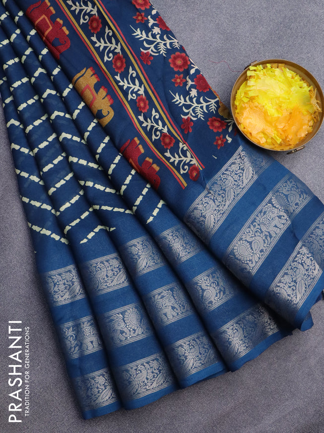 Semi georgette saree peacock blue with allover zig zag prints and long zari woven border