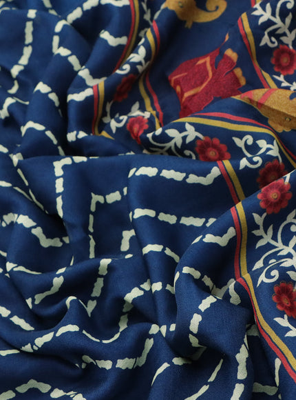 Semi georgette saree peacock blue with allover zig zag prints and long zari woven border