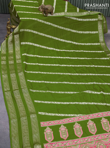 Semi georgette saree mehendi green with allover prints and long zari woven border