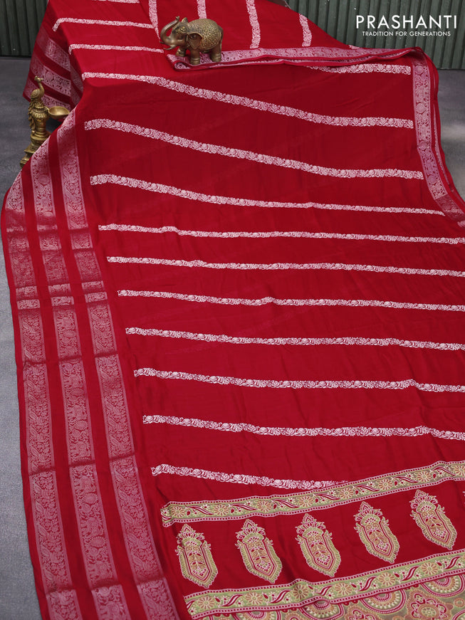 Semi georgette saree red with allover prints and long zari woven border