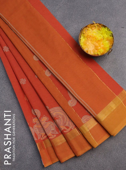 Chirala cotton saree rustic orange and mustard shade with butta prints and zari woven simple border