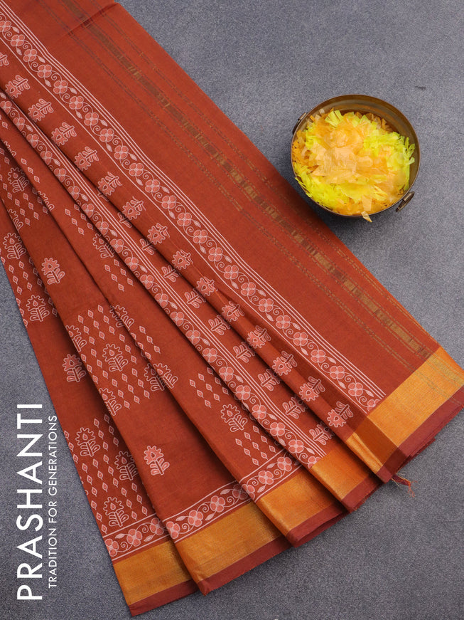 Chirala cotton saree rustic orange with allover prints and zari woven border