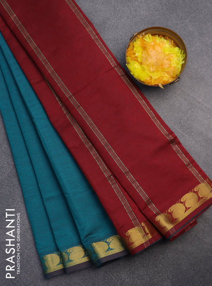 10 Yards poly cotton saree peacock green and maroon with plain body and paisley zari woven border